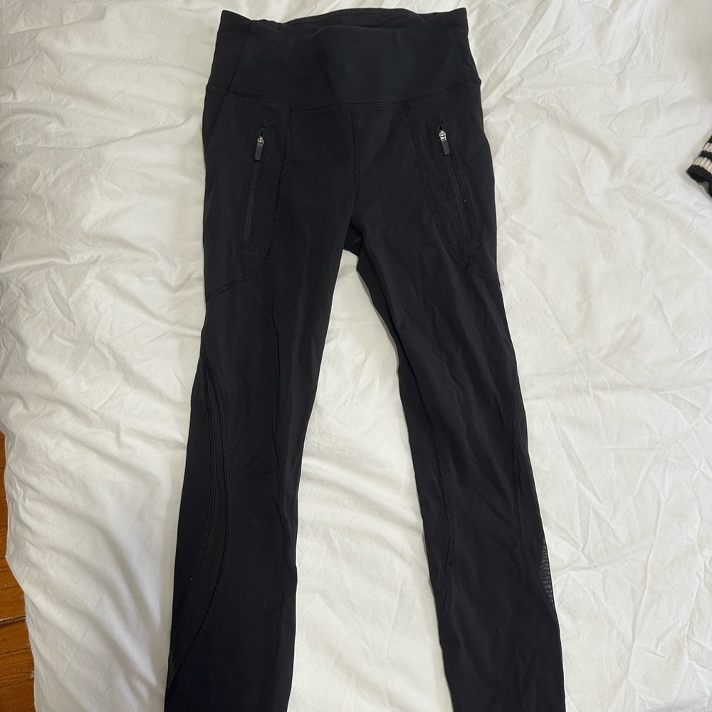 Lululemon Black Leggings with Mesh Detail on Calf (Size 4)